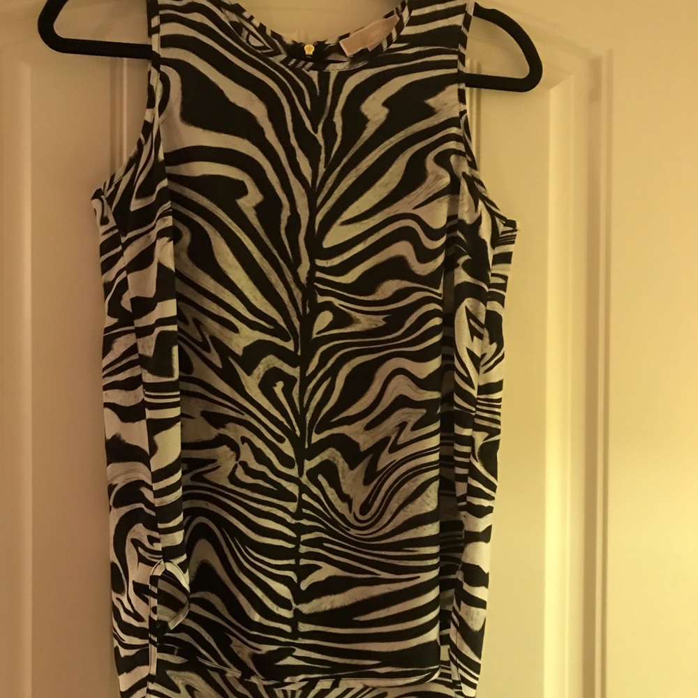 Black and white sleeveless top.